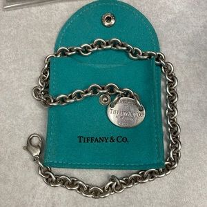 Authentic Tiffany necklace with “Please return to” on tag. With Tiffany blue bag